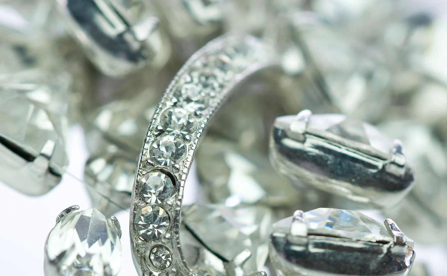 Detail of baguette crystals set beside pave rhinestone banding