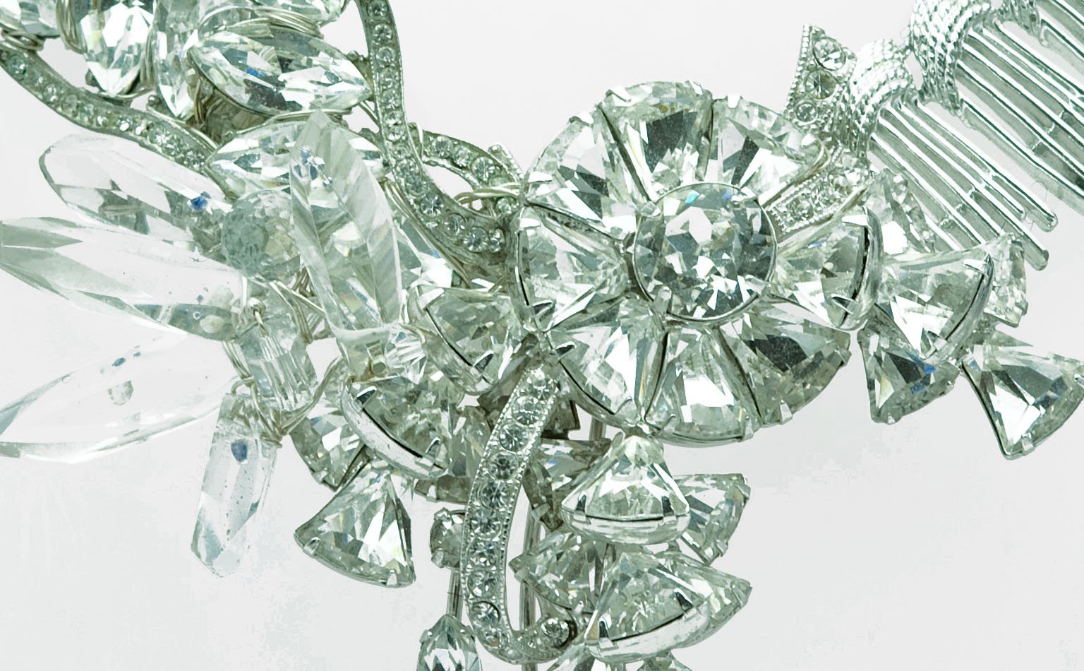 Detail of clear crystal spikes and faceted rounds in a cluster 