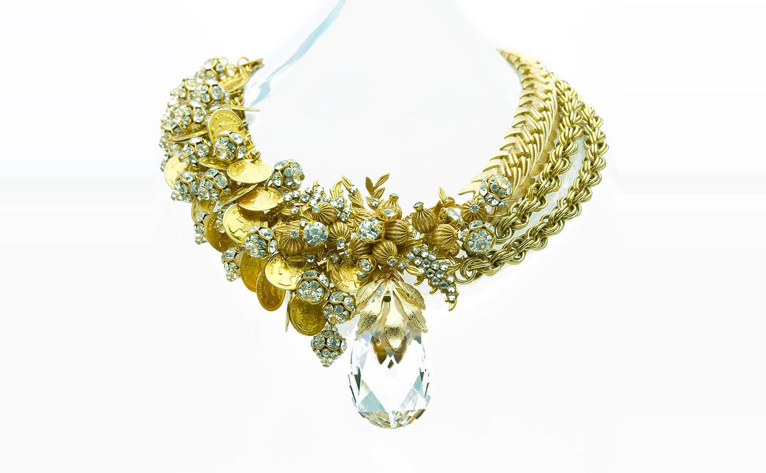 Gold-tone collar with a crystal cluster and a large faceted drop 