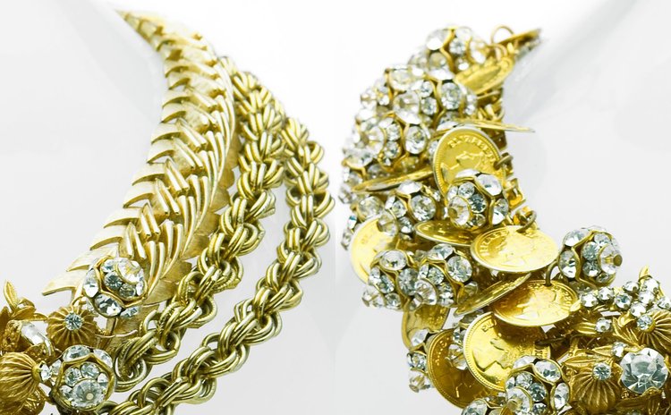 Gold herringbone chain beside a coin and rhinestone cluster