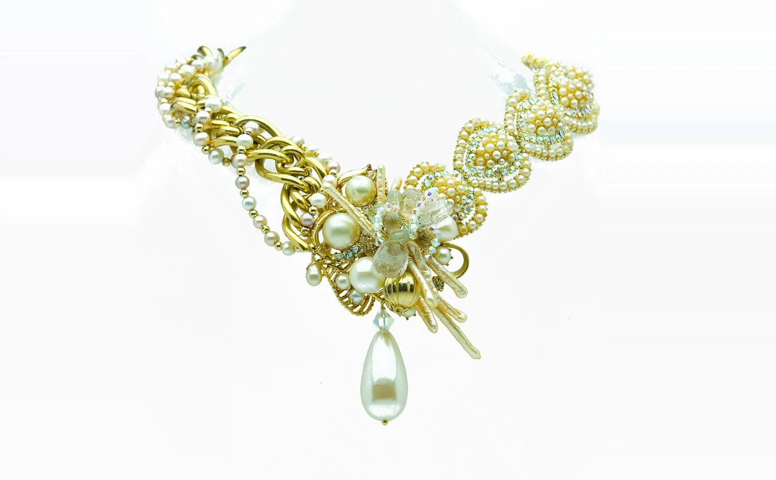Gold collar necklace with a rhinestone flower and a pearl drop 