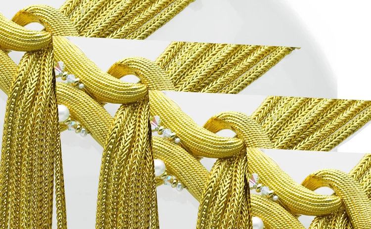Detail of knotted gold metal mesh chains
