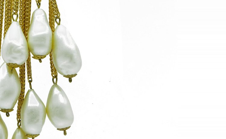 Detail of teardrop pearl drops suspended from gold chain