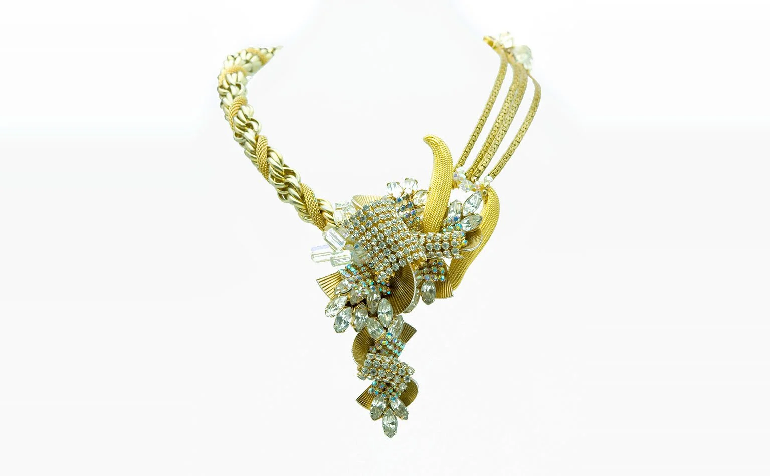 Gold necklace with a crystal cluster and a tapered drop 