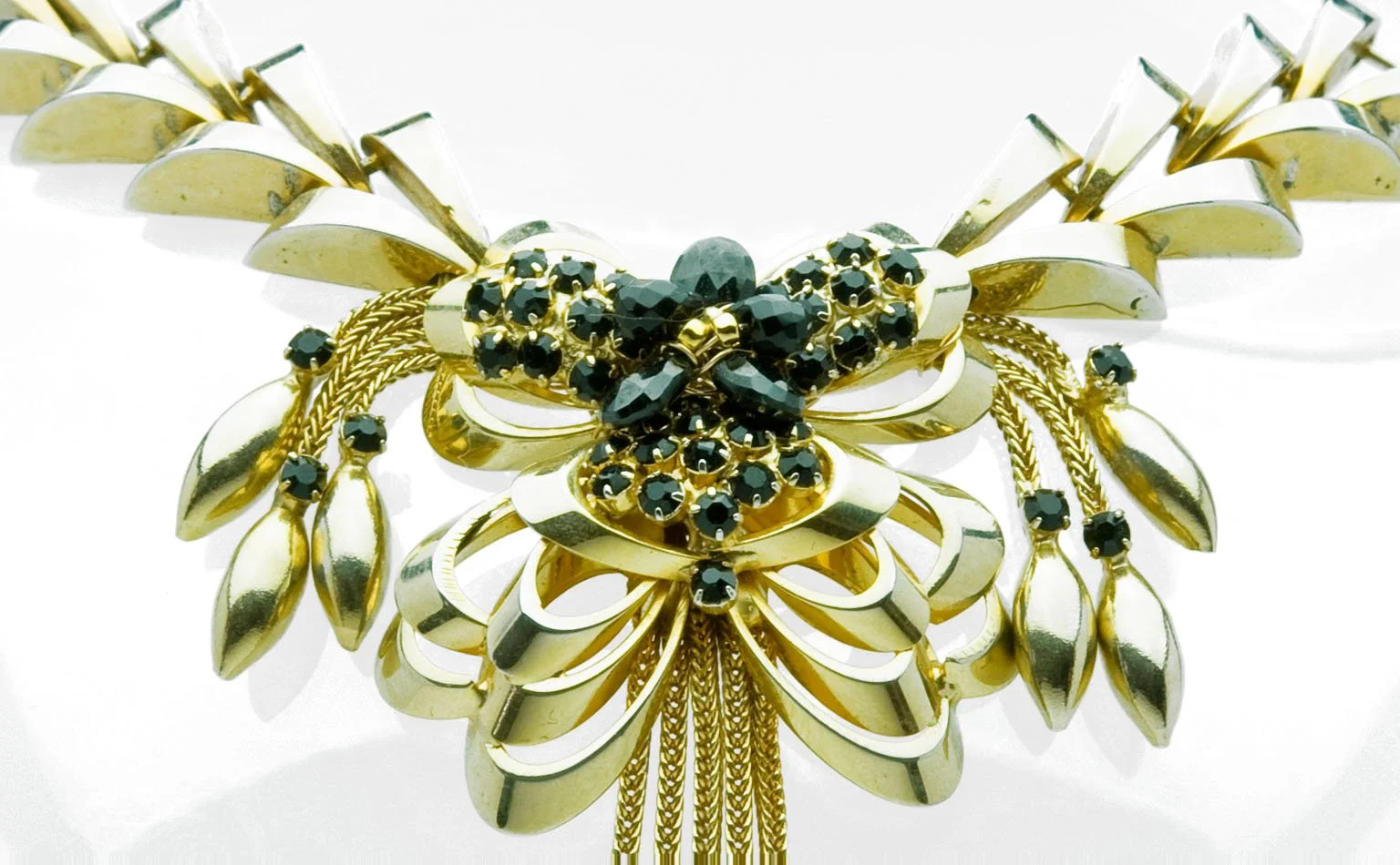 Gold leaf collar centered on a dark crystal cluster