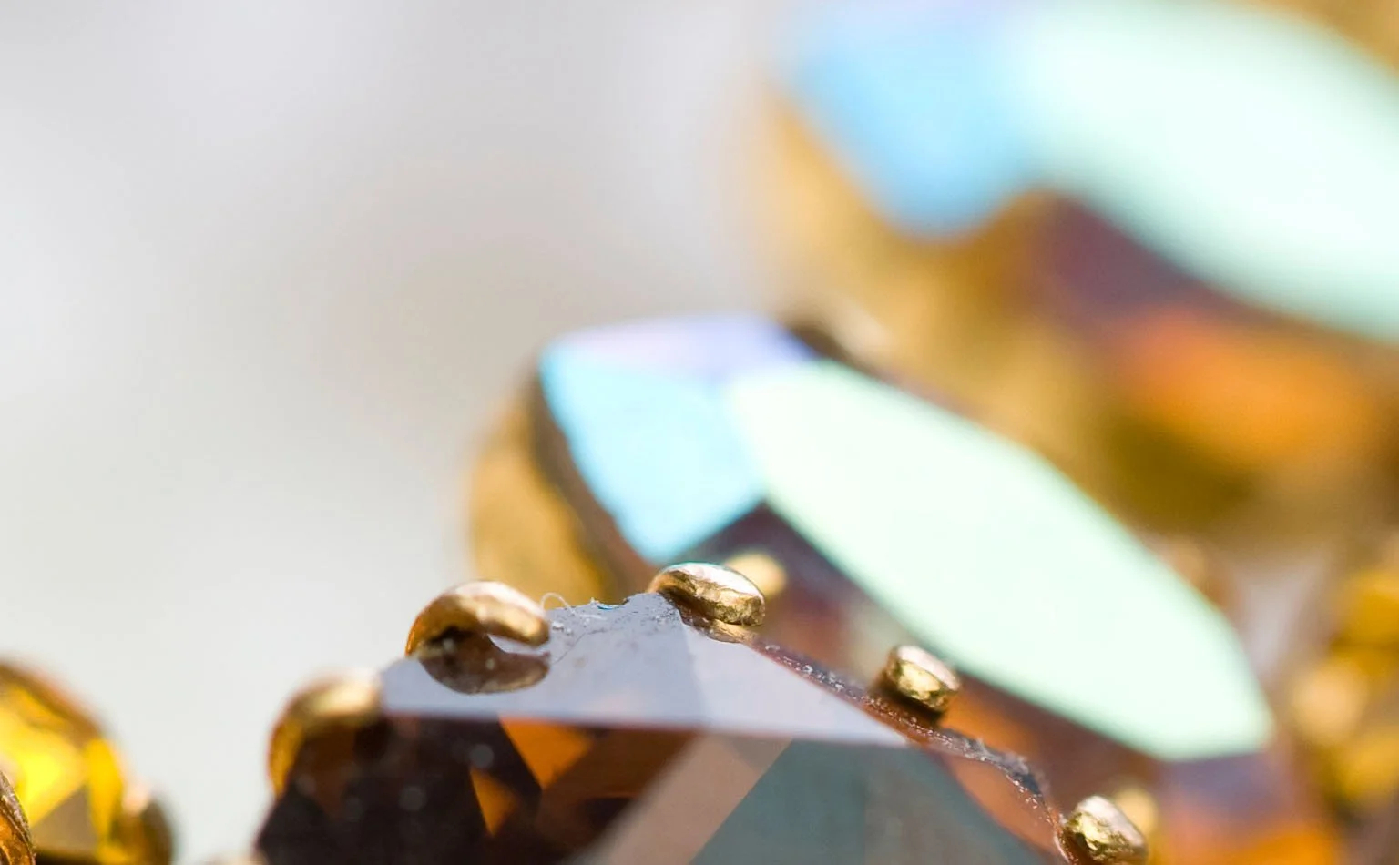 Close macro of an iridescent amber crystal facet 