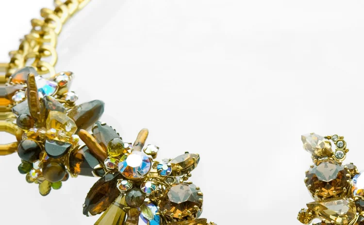 Detail of olive, amber and iridescent crystal massed on gold