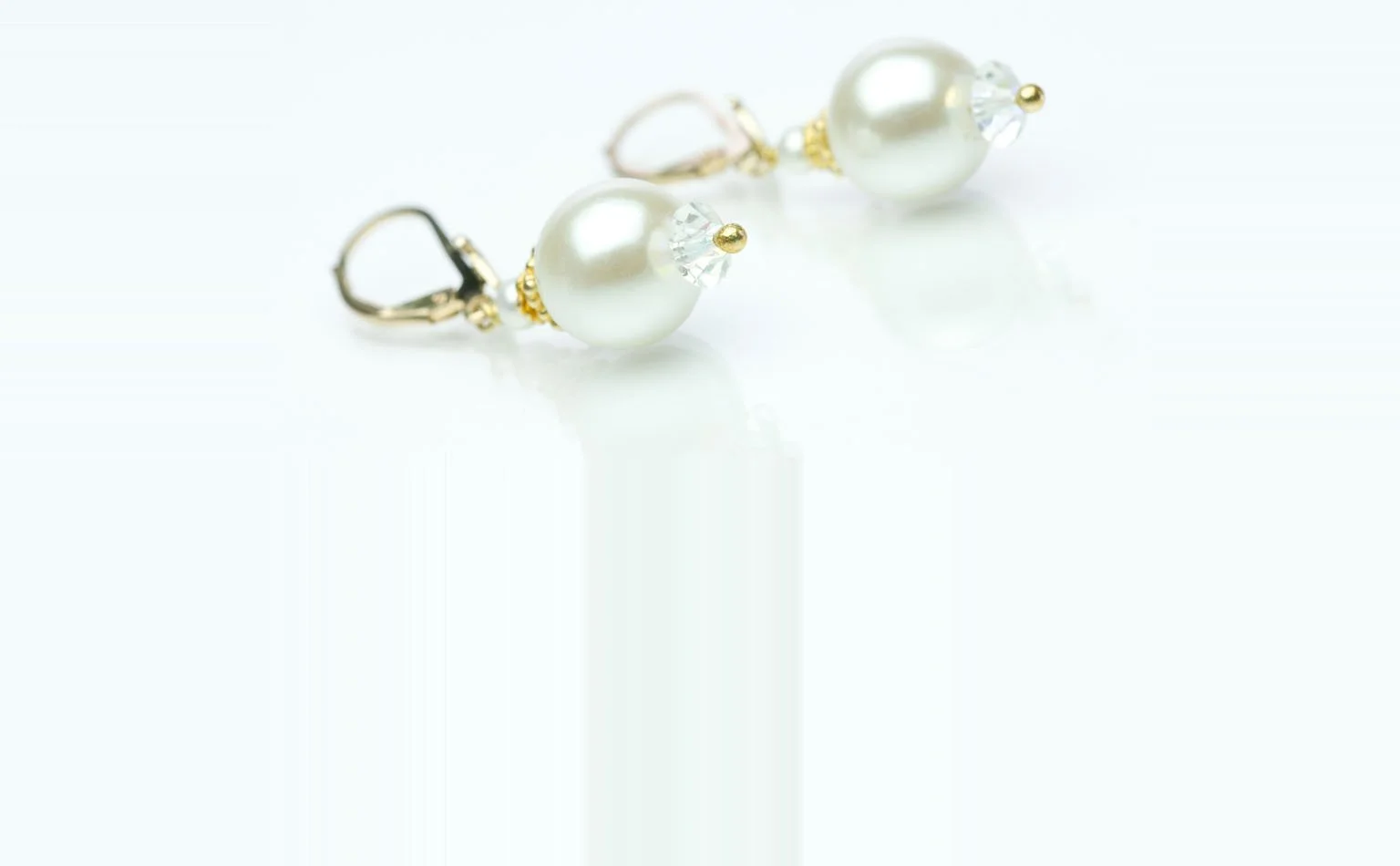 Pearl and crystal drop earrings on gold-tone lever backs 