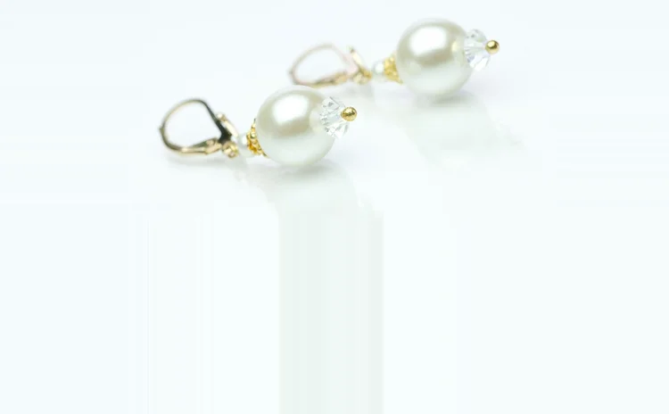 Pearl and crystal drop earrings on gold-tone lever backs