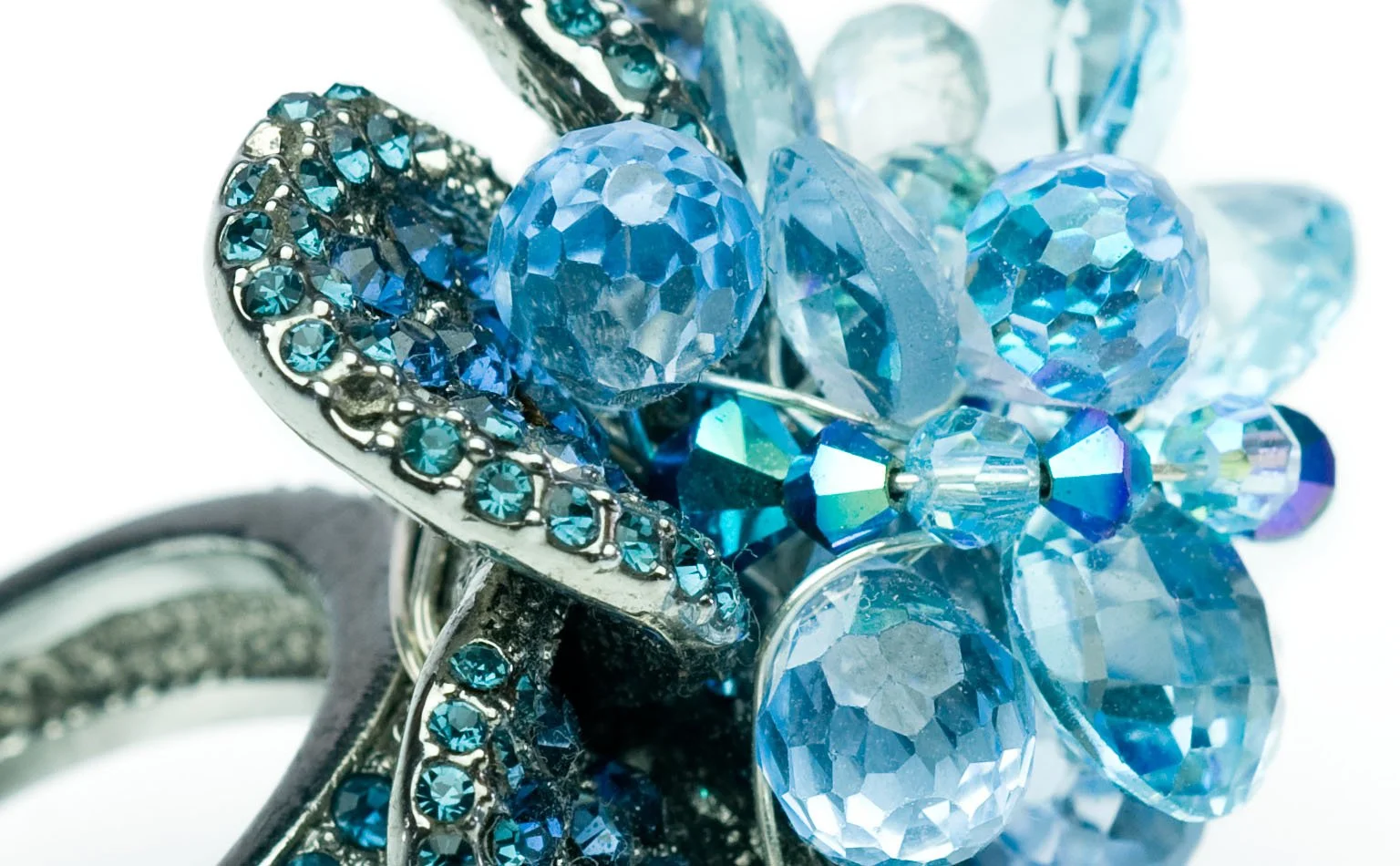 Blue crystal flower ring in a pave silver-tone setting