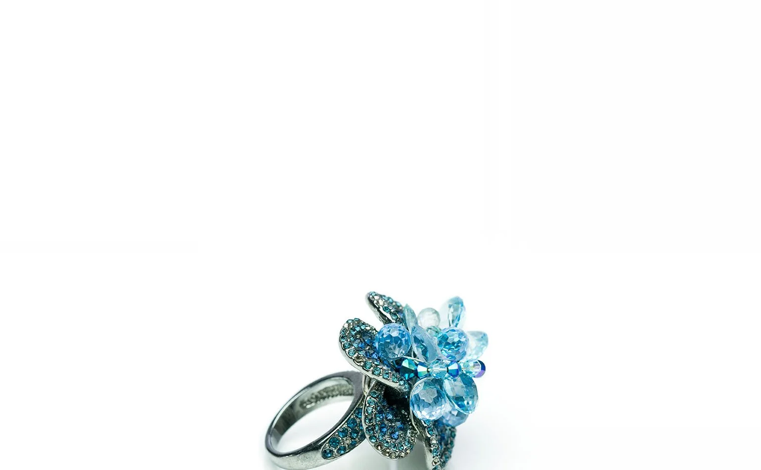Blue crystal cluster ring shown on a plain background