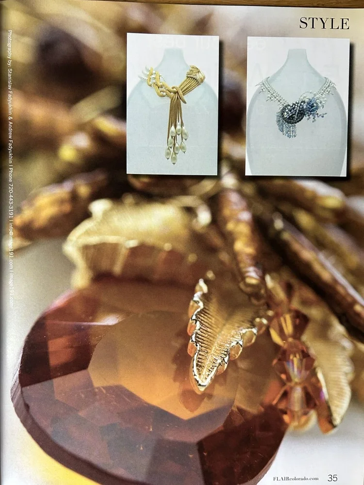 FLAIR page 35: two necklaces and a large amber stone