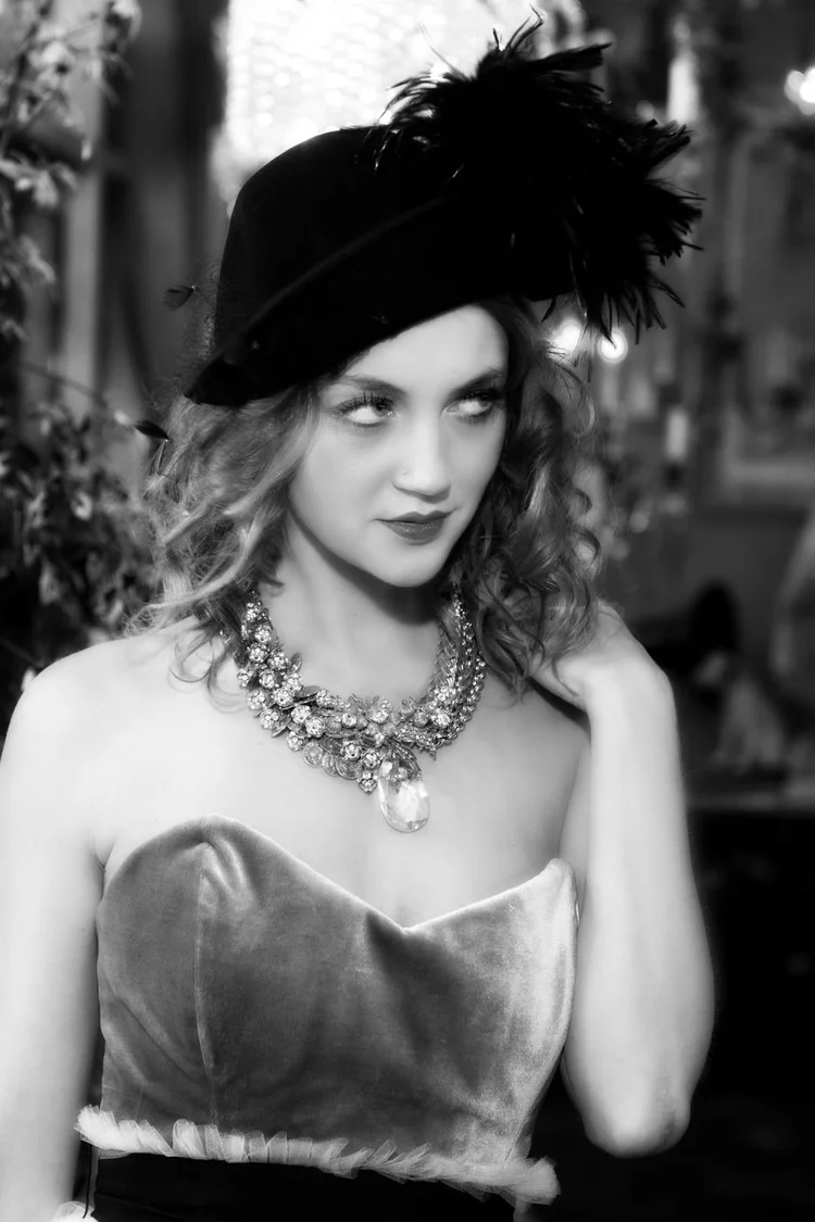 Black and white: a model in a black hat and fur stole