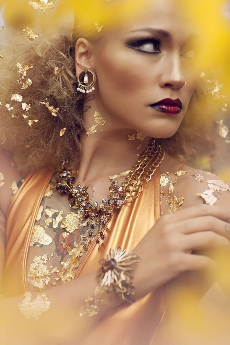 Stefanie Dolenc in gold leaf with a pearl and crystal headpiece and Andrea Li necklaces