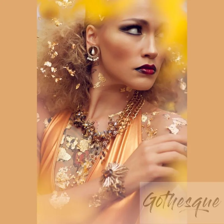 Gothesque image from the gold leaf shoot: Stefanie Dolenc in gold leaf with Andrea Li gold, pearl and crystal necklaces, hoop earrings and a ring, with the Gothesque watermark