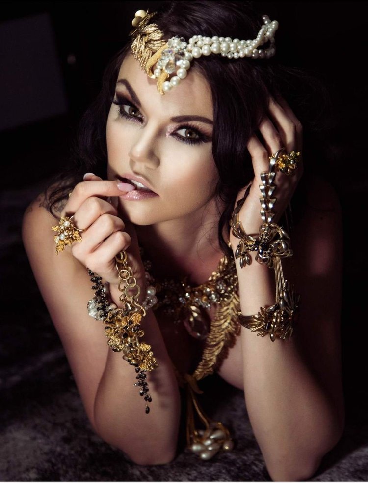Apt 5802 page: Ally Taylor in a gold leaf and pearl headpiece, Andrea Li gold cluster necklace, rings and bracelets