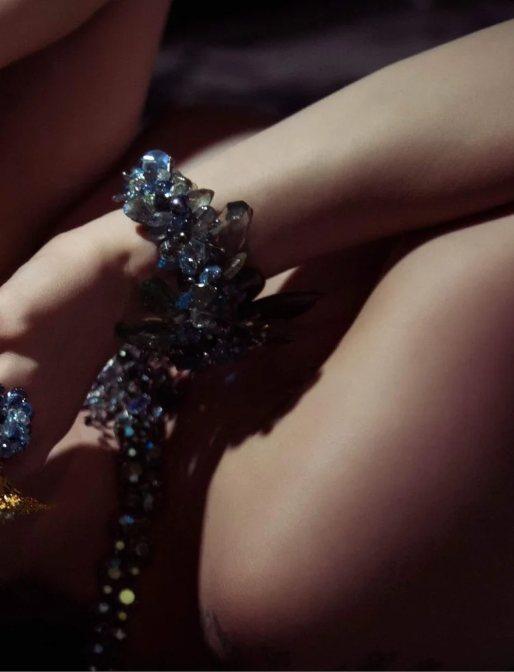 Apt 5802 page: a close view of an Andrea Li blue crystal cluster bracelet on a bent arm