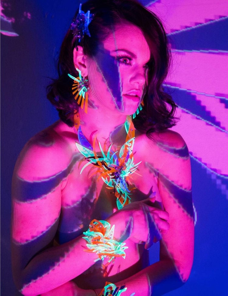Apt 5802 page: pink projected light and Andrea Li neon spiked earrings, necklace and rings