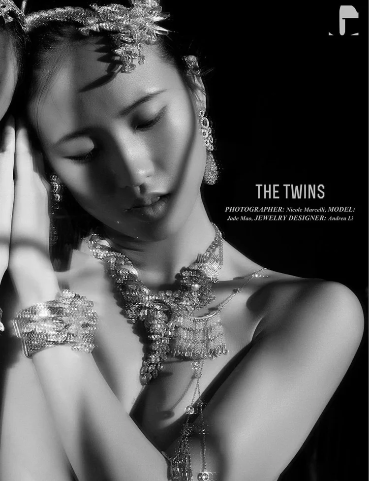 The Twins opener, page 55: Jade Mao and her mirror image, eyes closed, in Andrea Li crystal headpieces, necklaces and cuffs, with the printed credits