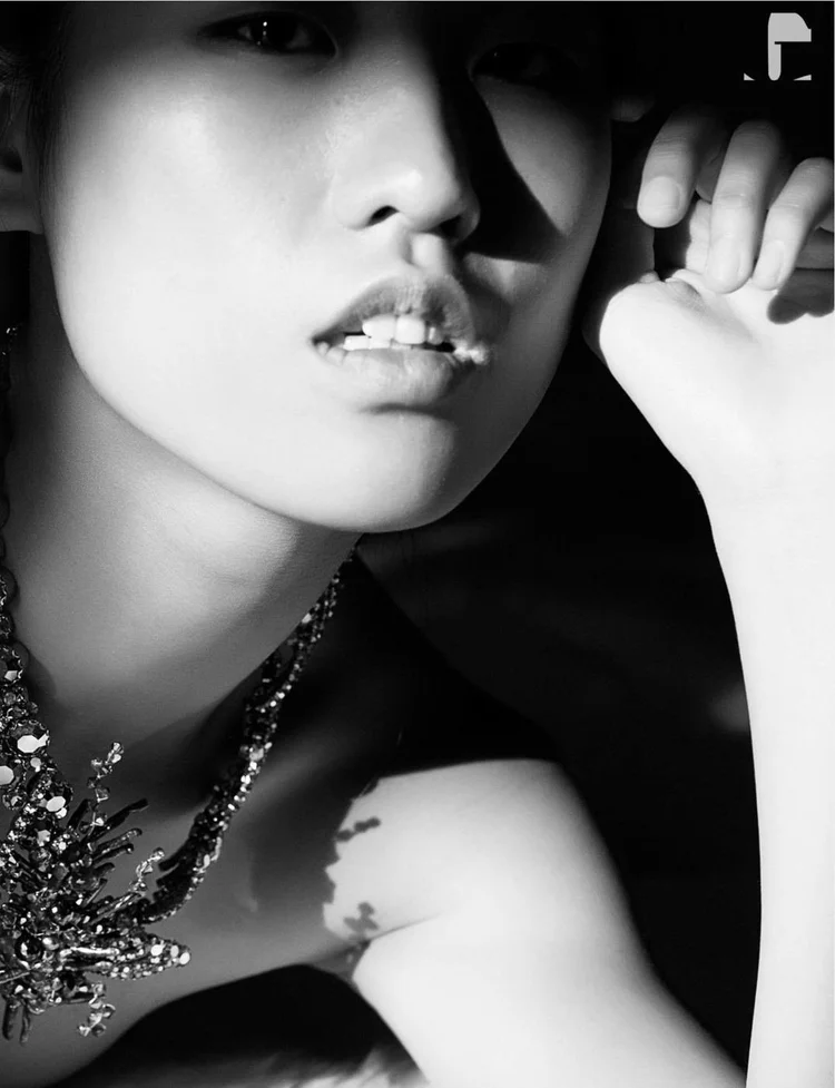 The Twins: a black and white close-up of model Jade Mao with an Andrea Li crystal necklace