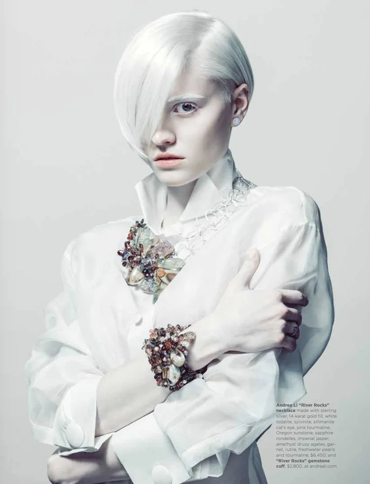 White Hot page: a platinum-haired model in white wearing the Andrea Li River Rocks necklace and gemstone cuff