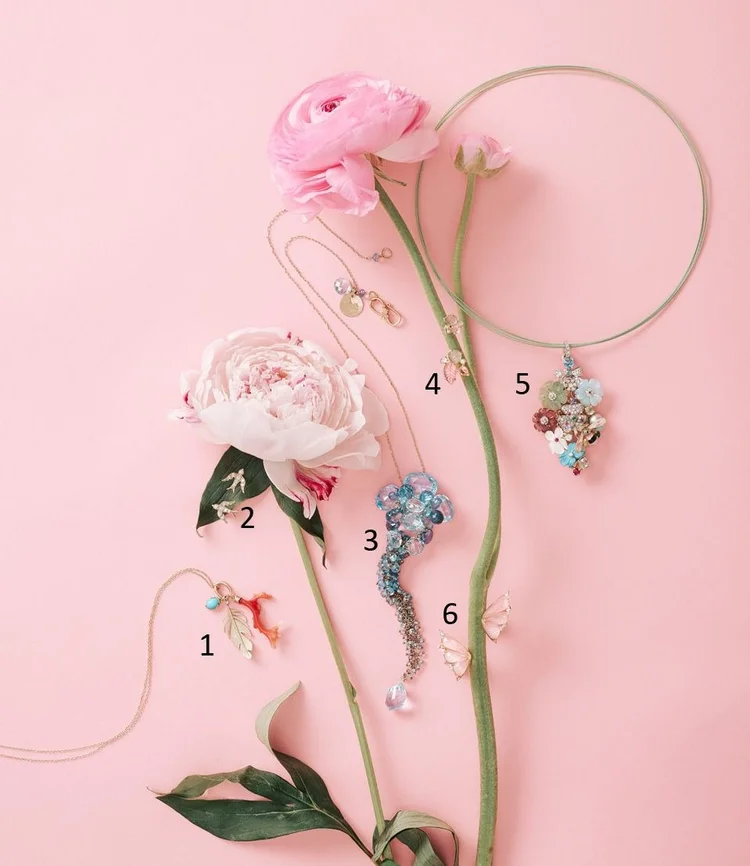 Still life on pink: six flower and animal pieces numbered 1 to 6 among roses, including the Andrea Li Talulah necklace