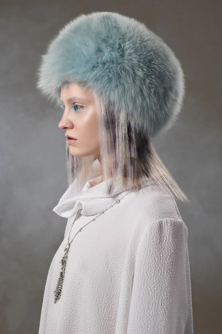 Profile in the blue fur hat with a long Andrea Li pendant necklace