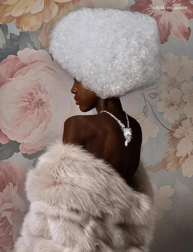 GMARO FEMME page 29: a model in a white curly wig and fur, seen from behind, wearing an Andrea Li crystal back necklace