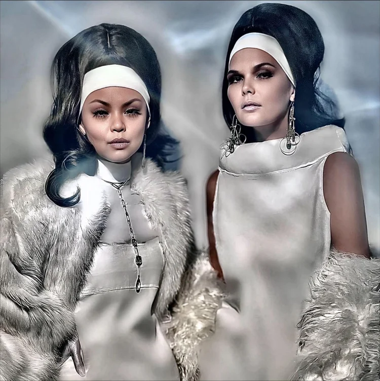Two models in pale fur and white headbands