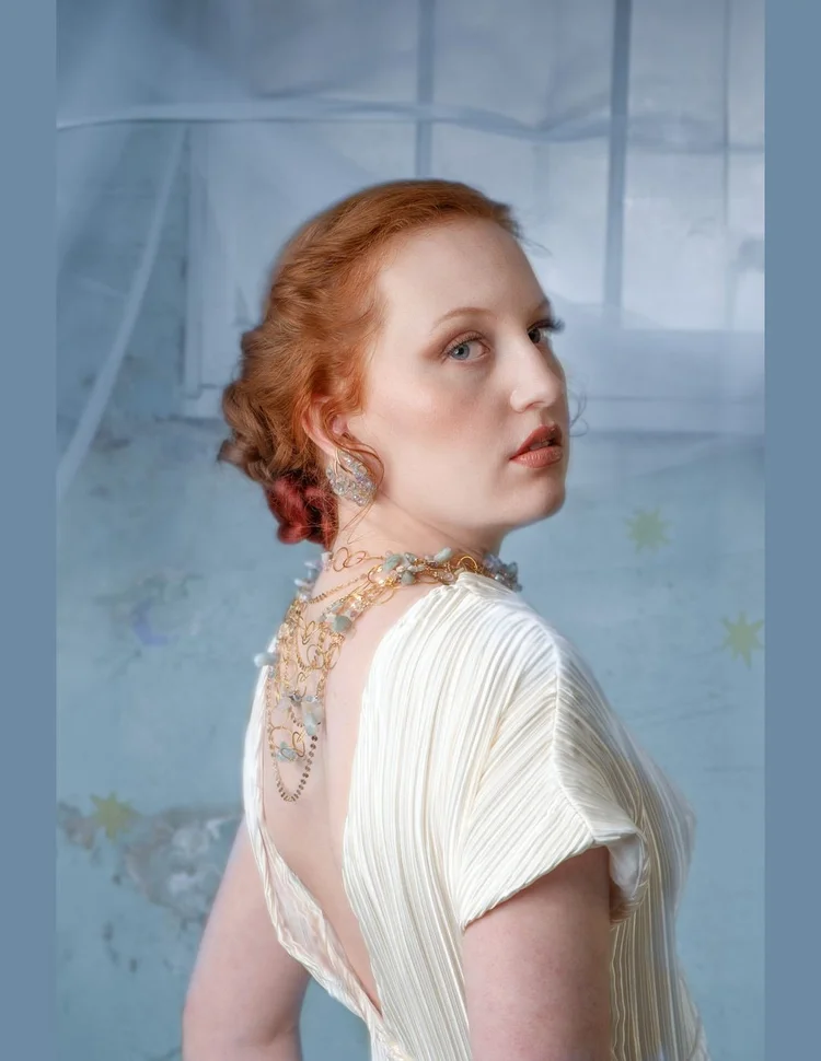 Over-the-shoulder portrait with the back necklace