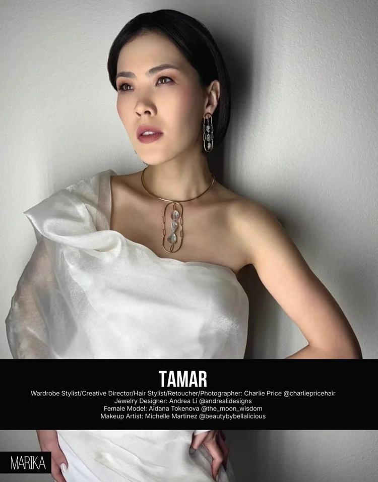 MARIKA Tamar credits page: the model in white organza wearing an Andrea Li gold and quartz pendant necklace, with the printed team credits