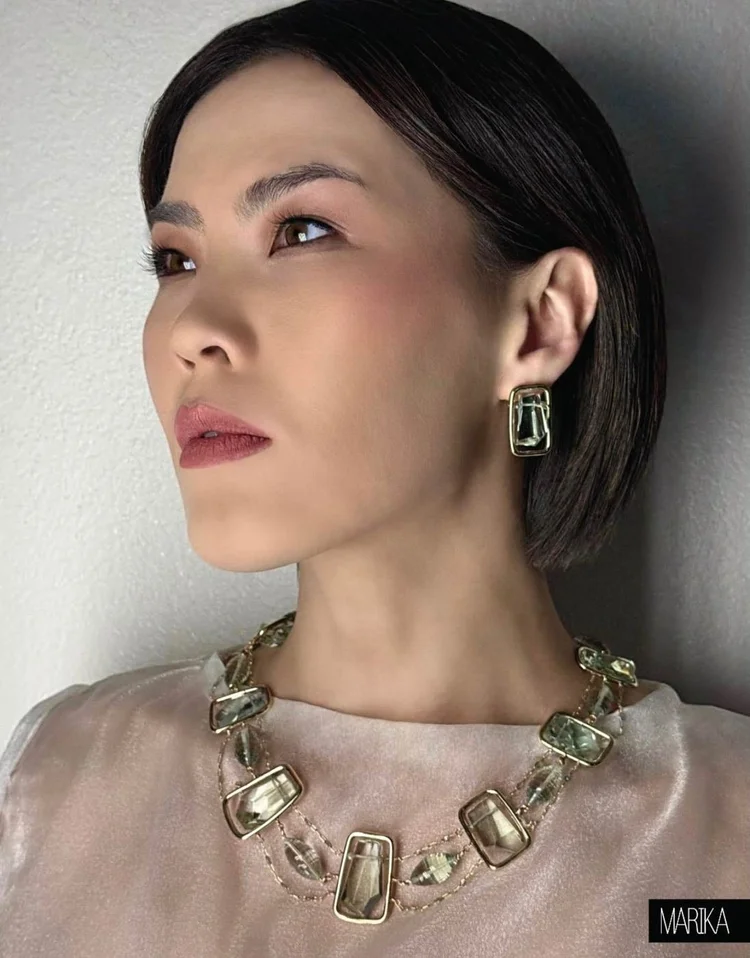 MARIKA Tamar page: profile portrait with an Andrea Li framed quartz necklace and matching earrings