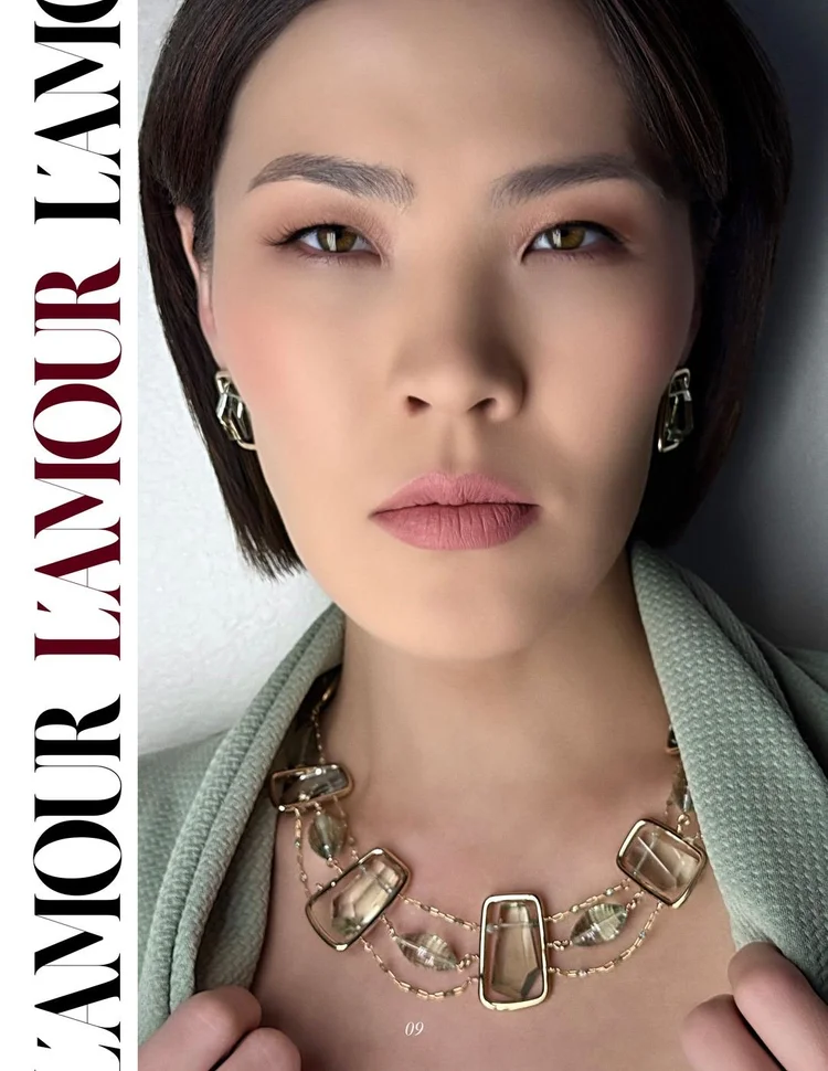 L'AMOUR page 09: close portrait in a sage jacket with an Andrea Li framed quartz necklace and earrings