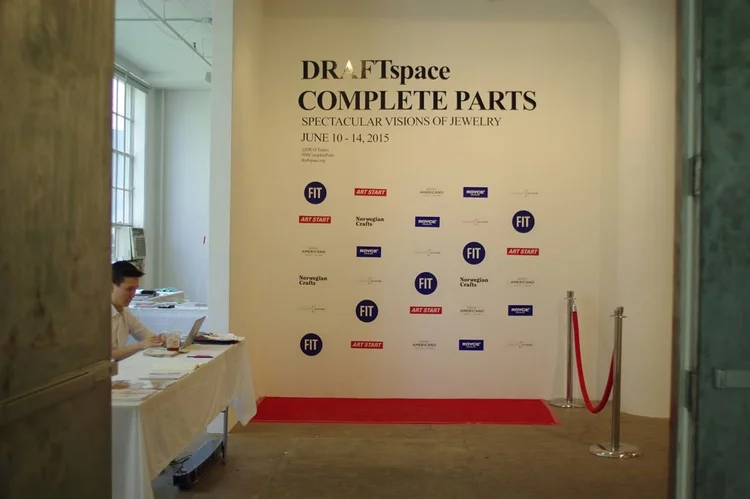 The DRAFTspace Complete Parts entrance backdrop with sponsor logos, a red carpet and the sign-in desk