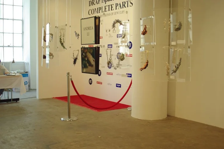 Andrea Li's hanging display beside the entrance backdrop and red carpet