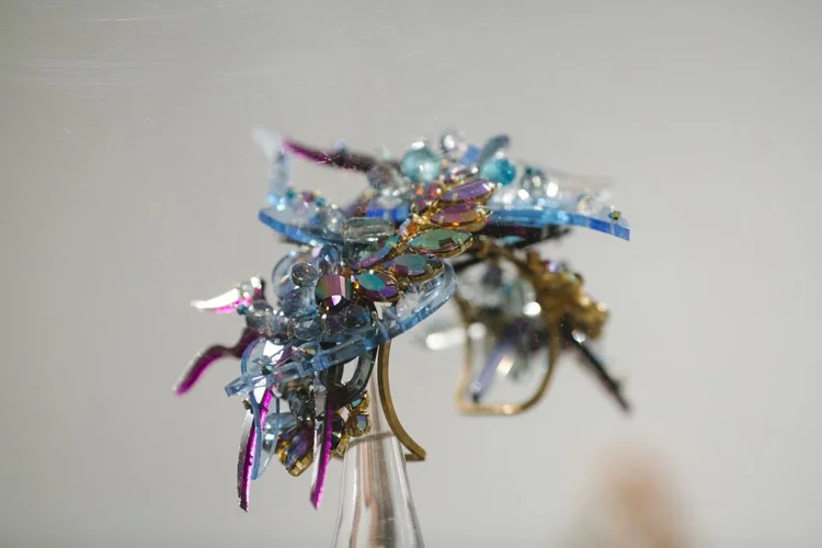 Close view of an Andrea Li iridescent purple and blue spiked cluster piece