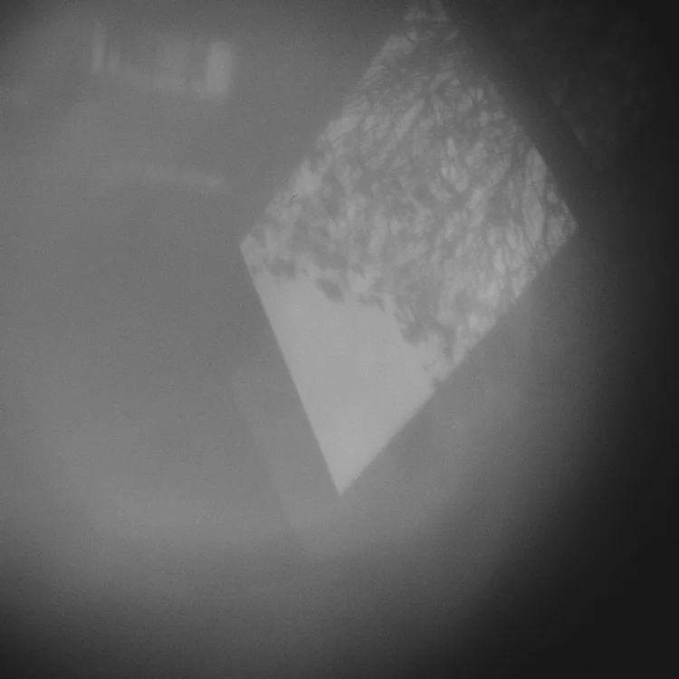 Black and white soft-focus abstract: a diamond of light