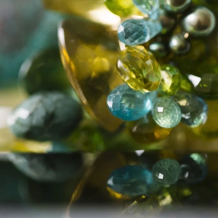 Green-toned soft-focus abstract: a diamond of light