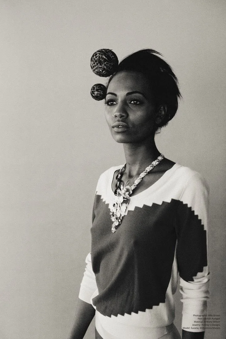 Black and white: a model with sphere hair ornaments, zigzag sweater and Andrea Li statement necklace