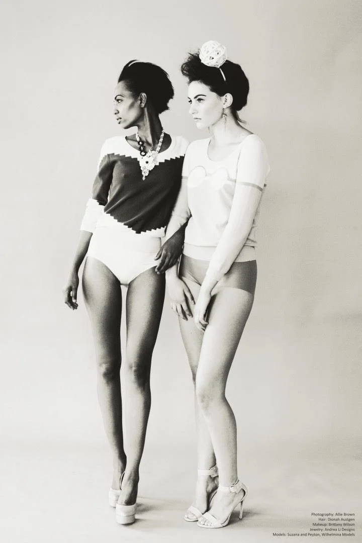 Black and white: two models standing together in sweaters and bodysuits, Andrea Li necklace