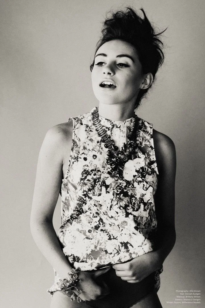 Black and white: a model in a floral top with an Andrea Li statement necklace and cuff