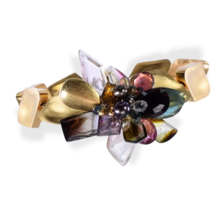 Andrea Li gold cuff bracelet with gold leaves and a cluster of dark and clear gemstones, by Andrea Li