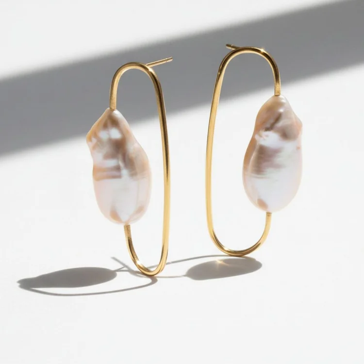 Gold link and baroque pearl drop earrings