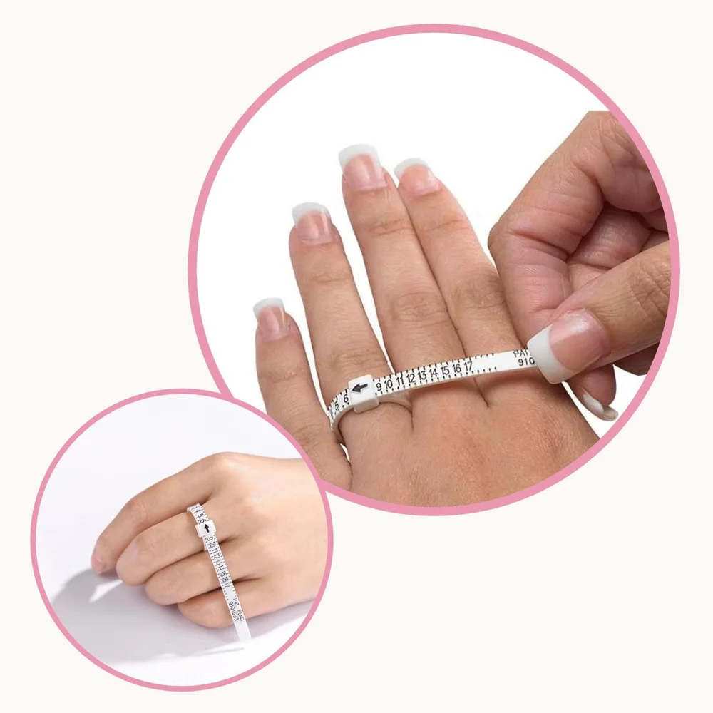 A ring sizer strap fastened around a finger like a belt, the size read at the arrow