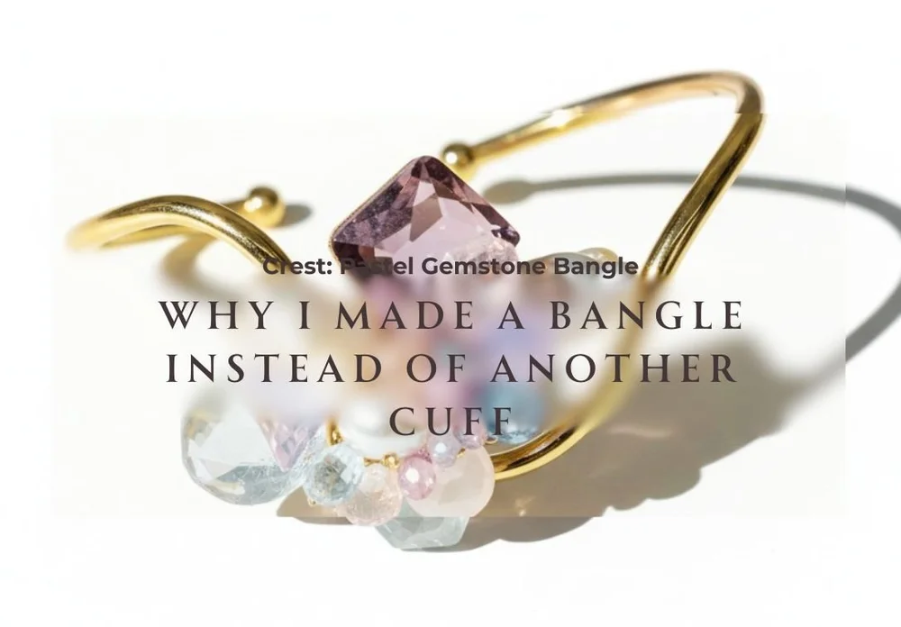 Crest, a gold pastel gemstone bangle with a faceted pink stone and a pale cluster, with the story title Why I Made a Bangle Instead of Another Cuff