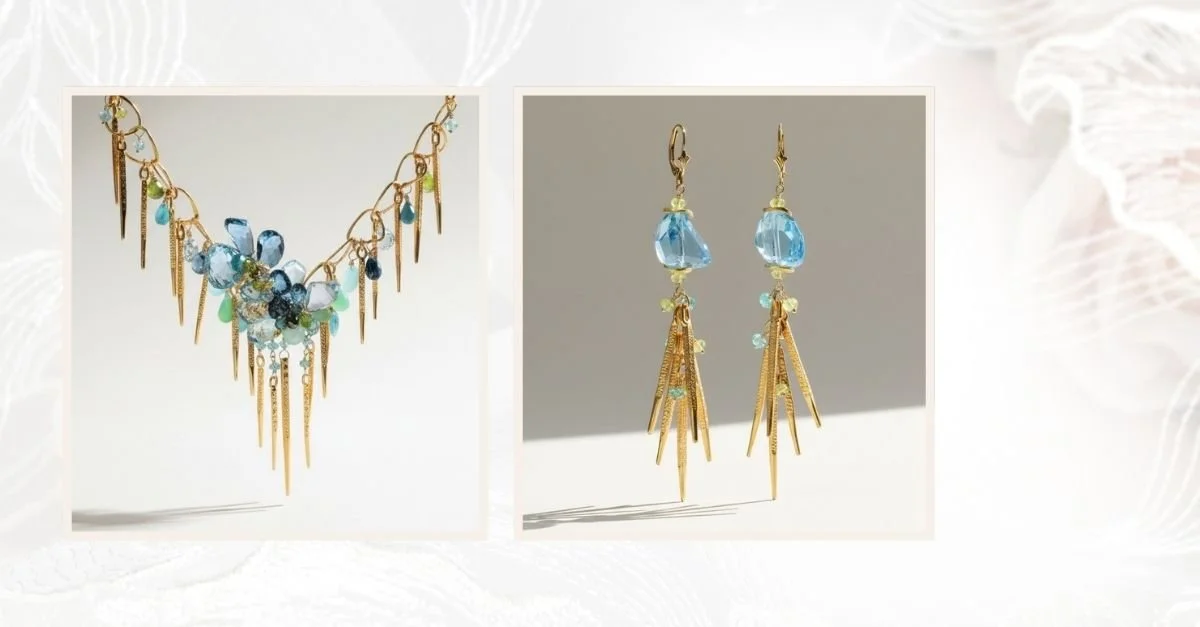 Side-by-side display of a blue gemstone statement necklace and matching gold drop earrings on a soft neutral background.