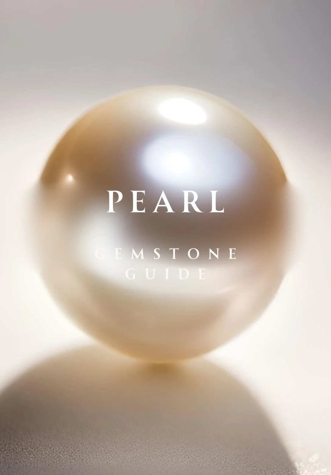 Close-up of a luminous, creamy-white pearl with soft reflections on a neutral background, overlaid with the text “Pearl Gemstone Guide.