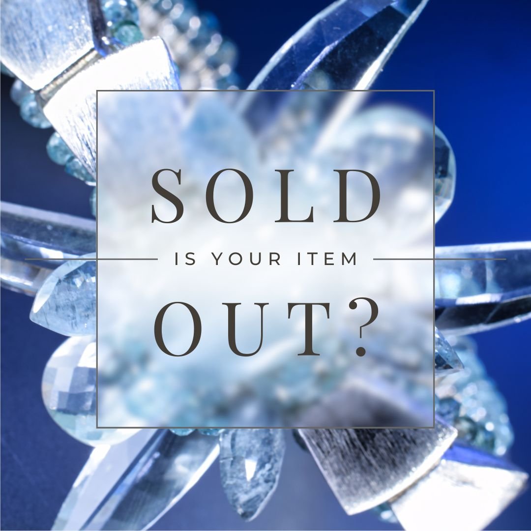 “SOLD — is your item out?” text overlay in a translucent box on a blue-toned close-up of faceted light-blue gemstones and silver jewelry.