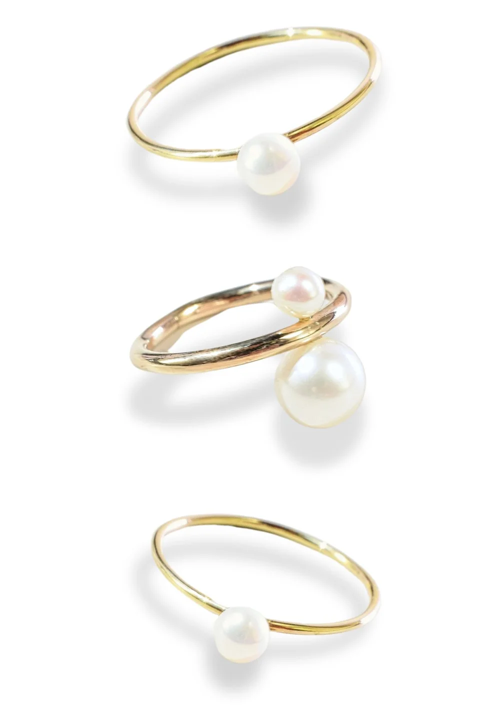 Three Andrea Li gold stacking and midi rings with pearls, by Andrea Li