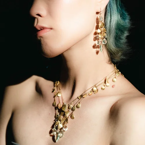 A model wearing an Andrea Li princess-length necklace at the collarbone